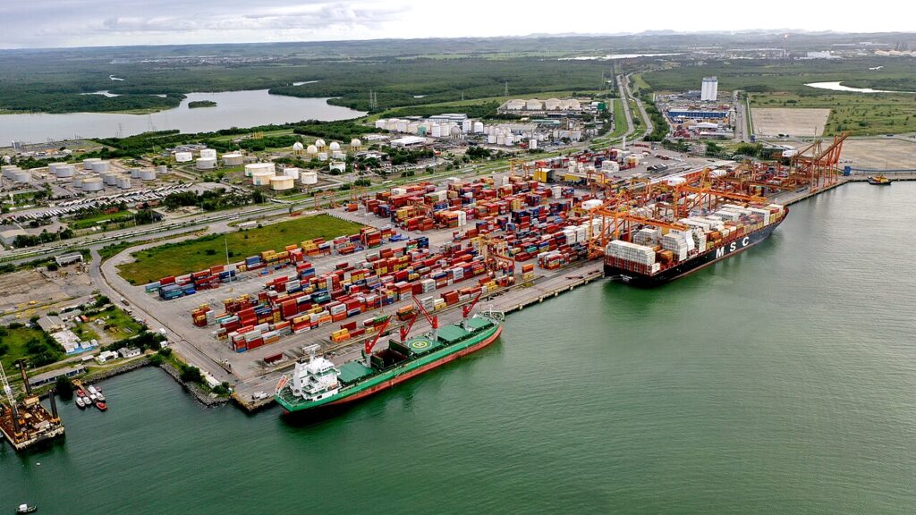 Aerial view of Tecon Suape with container yards, quay cranes and vessels alongside